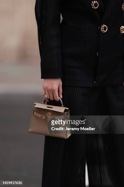 Marina von Lison seen wearing Hermes mini Kelly beige leather bagand Nicolas Besson matching suit before Alexandre Vauthier show during Paris Fashion...