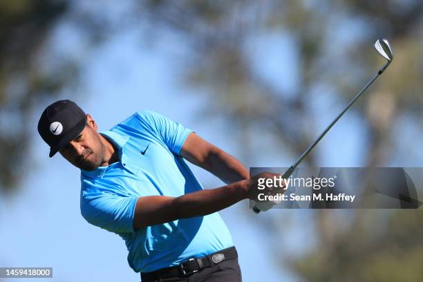 Tony Finau hits his first shot on the 2nd hole of the South Course during the first round of the Farmers Insurance Open at Torrey Pines Golf Course...