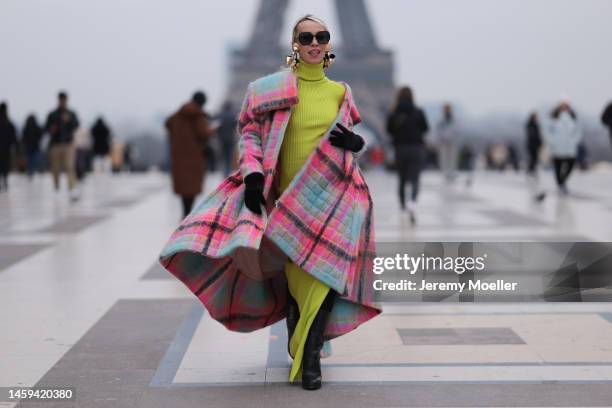 Denisa Palsha seen wearing plaid coat by Delpozo, dress Vetement, earrings Graham Cruz , boots Maison Margiela, glasses Dior before Stephane Rolland...