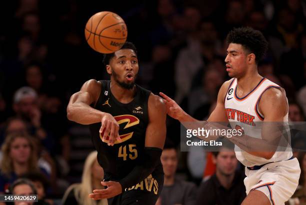 Donovan Mitchell of the Cleveland Cavaliers passes the ball as Quentin Grimes of the New York Knicks defends in the third quarter at Madison Square...
