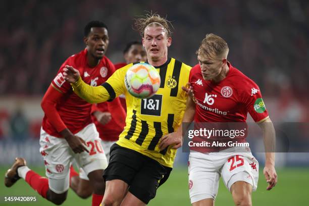 Julian Brandt of Borussia Dortmund battles for possession with Andreas Hanche-Olsen of 1.FSV Mainz 05 during the Bundesliga match between 1. FSV...