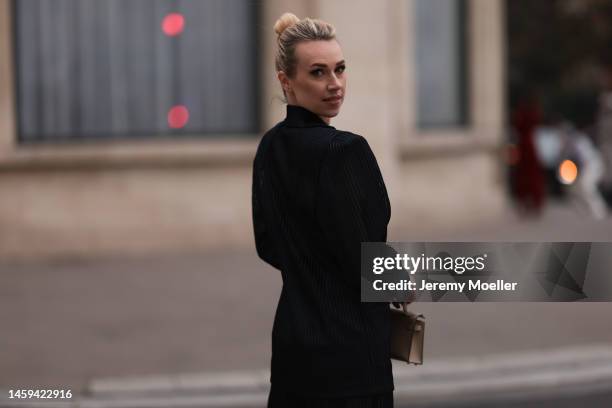 Marina von Lison seen wearing Hermes mini Kelly beige leather bag and Nicolas Besson matching suit before Alexandre Vauthier show during Paris...