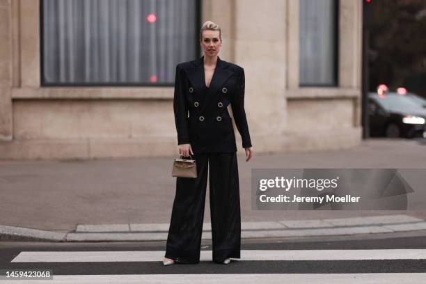 Marina von Lison seen wearing Hermes mini Kelly beige leather bag, Alexandre Vauthier sparkling transparent heels and Nicolas Besson matching suit...