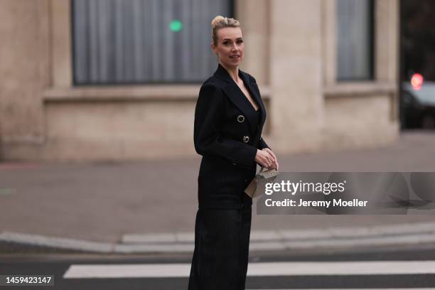 Marina von Lison seen wearing Hermes mini Kelly beige leather bag and Nicolas Besson matching suit before Alexandre Vauthier show during Paris...