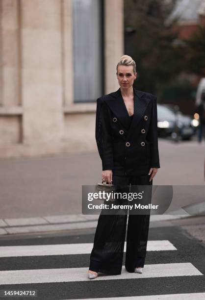 Marina von Lison seen wearing Hermes mini Kelly beige leather bag, Alexandre Vauthier sparkling transparent heels and Nicolas Besson matching suit...