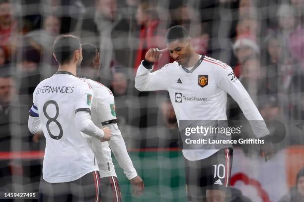 Marcus Rashford of Manchester United celebrates after scoring the team's first goal during the Carabao Cup Semi Final 1st Leg match between...