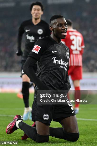 Randal Kolo Muani of Eintracht Frankfurt celebrates after scoring the team's first goal during the Bundesliga match between Sport-Club Freiburg and...