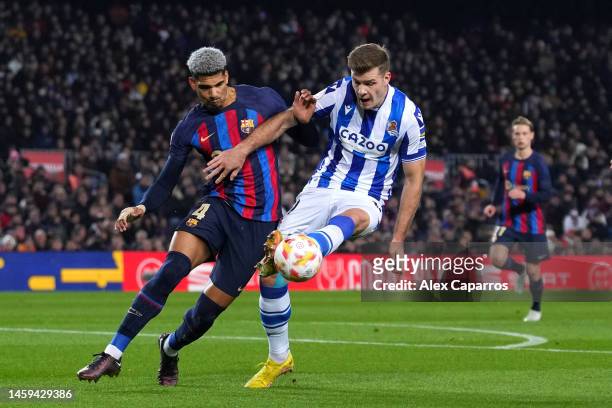 Ronald Araujo of FC Barcelona challenges Alexander Sorloth of Real Sociedad during the Copa Del Rey Quarter Final match between FC Barcelona and Real...