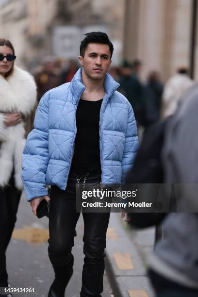 Chris Olsen seen wearing a blue puffer jacket, a black shirt, black leather pants and black boots before the Ludovic de Saint Sernin show on January...