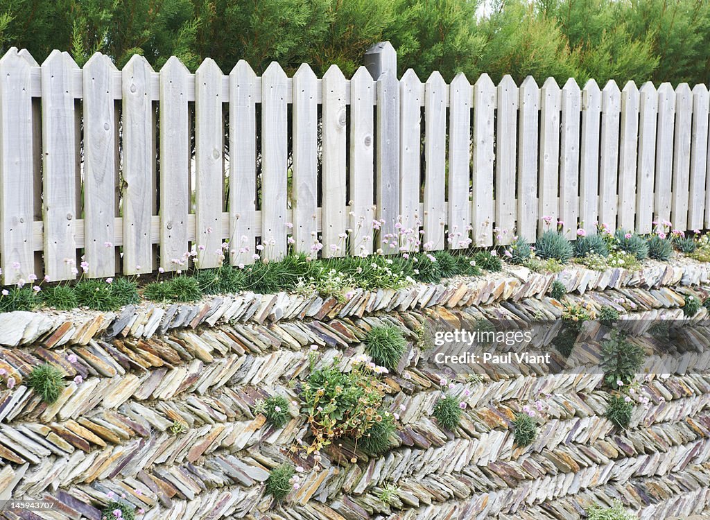 Picket fence and dry stone wall