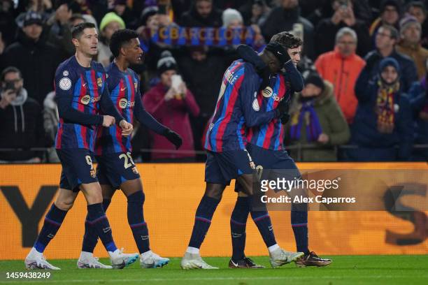Ousmane Dembele of FC Barcelona celebrates with teammates after scoring the team's first goal during the Copa Del Rey Quarter Final match between FC...