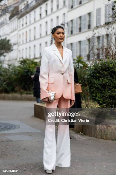 Pritika Swarup wears shaded two tone white rose suit with flared pants, silver bag outside Elie Saab during Paris Fashion Week - Haute Couture Spring...