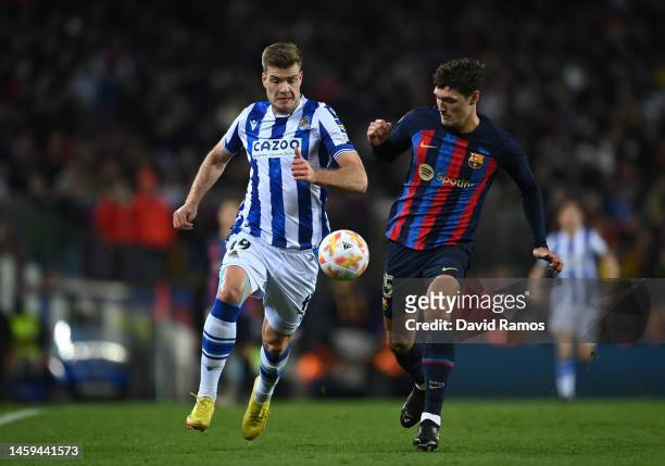 Andreas Christensen of FC Barcelona is challenged by Alexander Sorloth of Real Sociedad during the Copa Del Rey Quarter Final match between FC...