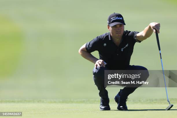 Justin Thomas lines up a putt on the 6th hole of the South Course during the first round of the Farmers Insurance Open at Torrey Pines Golf Course on...