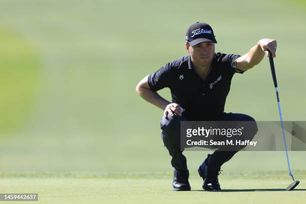 Justin Thomas lines up a putt on the 6th hole of the South Course during the first round of the Farmers Insurance Open at Torrey Pines Golf Course on...