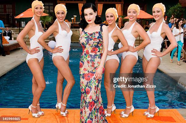 Dita Von Teese and the Aqualillies pose at the Cointreau and Dita Von Teese Launch Summer Bar Cart Cocktail Program at Poolside Soiree on June 7,...