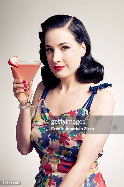 Dita Von Teese poses for a portrait at the Cointreau and Dita Von Teese Launch Summer Bar Cart Cocktail Program at Poolside Soiree on June 7, 2012 at...