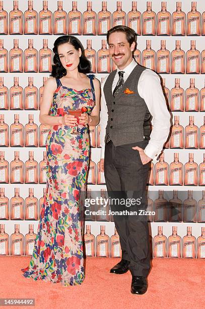 Dita Von Teese and Kyle Ford pose at the Cointreau and Dita Von Teese Launch Summer Bar Cart Cocktail Program at Poolside Soiree on June 7, 2012 at...