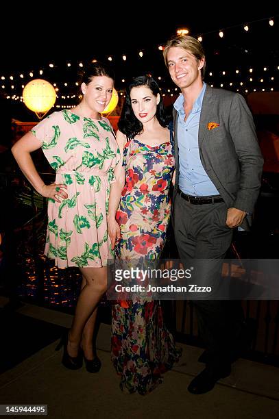 Ashley Turkett, Dita Von Teese and Steel Cooper attend the Cointreau and Dita Von Teese Launch Summer Bar Cart Cocktail Program at Poolside Soiree on...