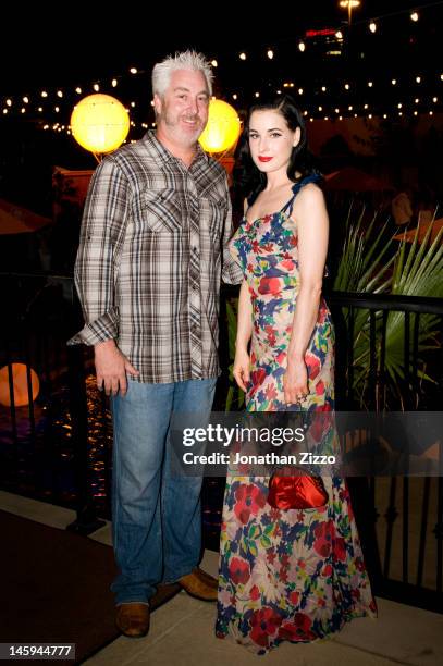 Greg Bothwell and Dita Von Teese attend the Cointreau and Dita Von Teese Launch Summer Bar Cart Cocktail Program at Poolside Soiree on June 7, 2012...