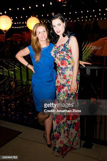 Suzie Cesco and Dita Von Teese attend the Cointreau and Dita Von Teese Launch Summer Bar Cart Cocktail Program at Poolside Soiree on June 7, 2012 at...