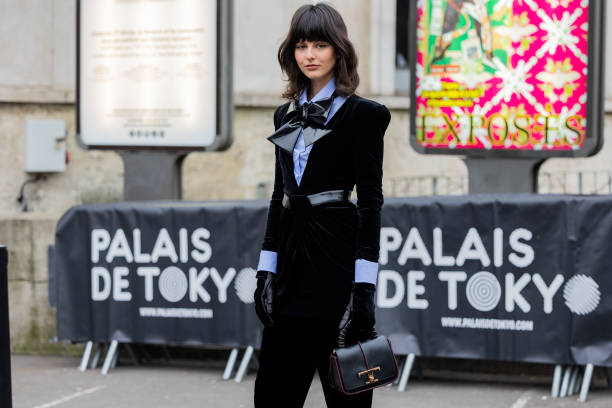 FRA: Street Style - Paris Fashion Week - Haute Couture Spring Summer  : Day Three