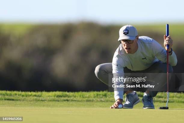 Ben Crane lines up a putt on the 7th hole of the South Course during the first round of the Farmers Insurance Open at Torrey Pines Golf Course on...