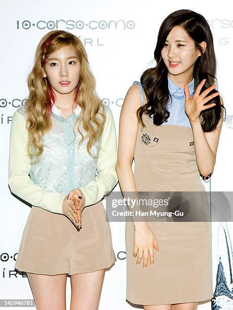 South Korean girl group, Taeyeon and Seohyun of Girls' Generation poses for media at a launching party for collaboration between '10 Corso Como' and...