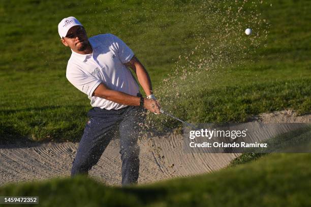 Michael Herrera hits from a bunker on the 9th hole of the North Course during the first round of the Farmers Insurance Open at Torrey Pines Golf...