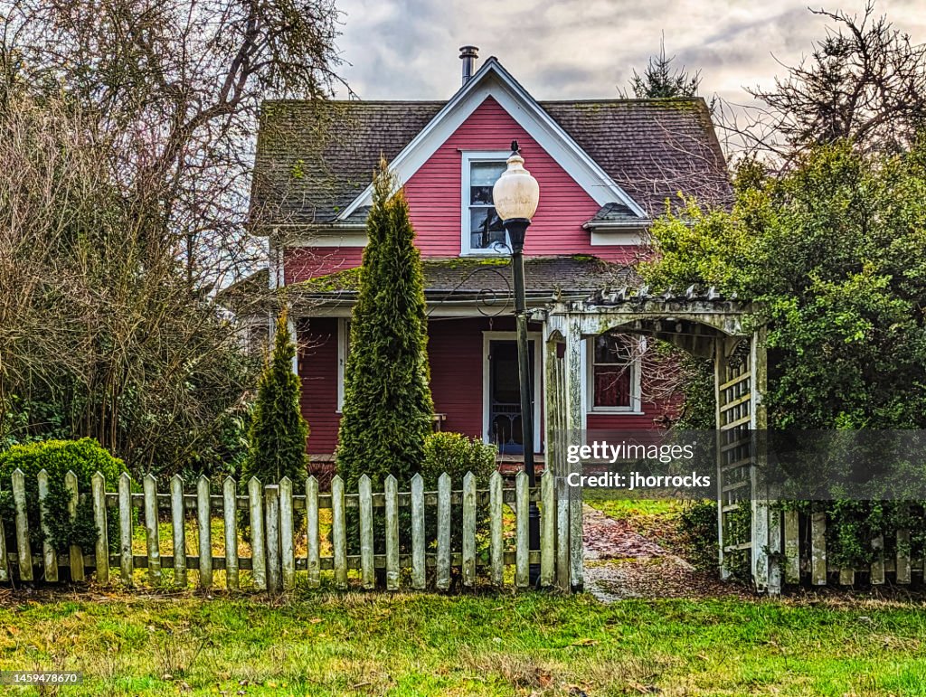 Old Red House with Picket Fence