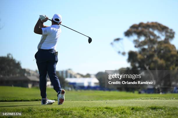 Michael Herrera hits his first shot on the 18th hole of the North Course during the first round of the Farmers Insurance Open at Torrey Pines Golf...