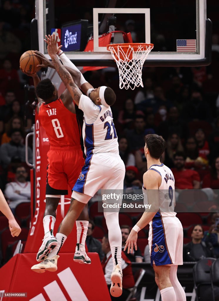 Wizards Rockets Jae'Sean Tate of the Houston Rockets drives to the basket on Daniel ...