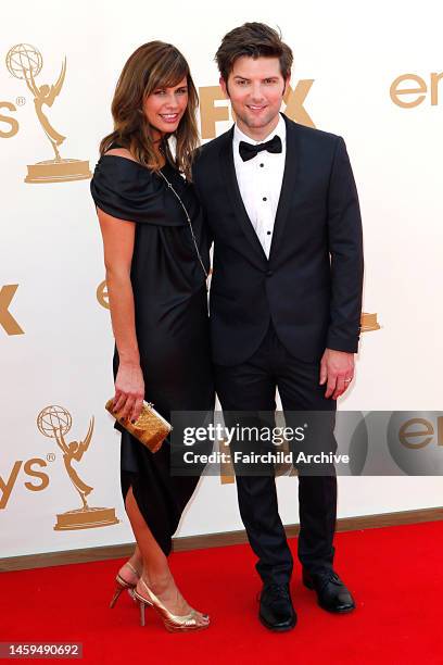 Naomi Sablan and Adam Scott attend the 63rd annual Primetime Emmy Awards at the Nokia Theatre.