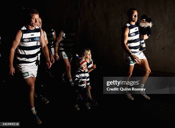 David Wojcinski of the Cats leads the team out onto the field during the round 11 AFL match between the Carlton Blues and the Geelong Cats at Etihad...