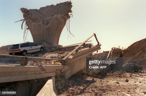 Cars lie smashed by the collapsed Interstate 5 connector few hours after Northridge earthquake, on January 17 in Sylmar, California. Federal...