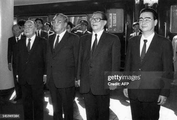 North Korean leader Kim Il Sung listens to the national anthem upon arrival at Beijing railway station during his goodwill visit on October 04 stand...