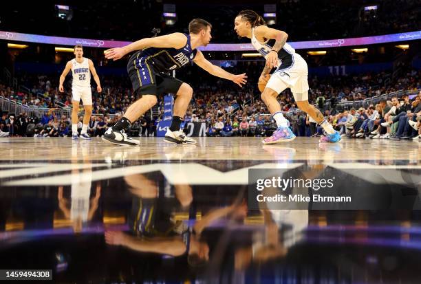 Cole Anthony of the Orlando Magic drives on T.J. McConnell of the Indiana Pacers during a game at Amway Center on January 25, 2023 in Orlando,...