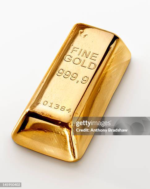 single gold ingot - gold bullion stockfoto's en -beelden