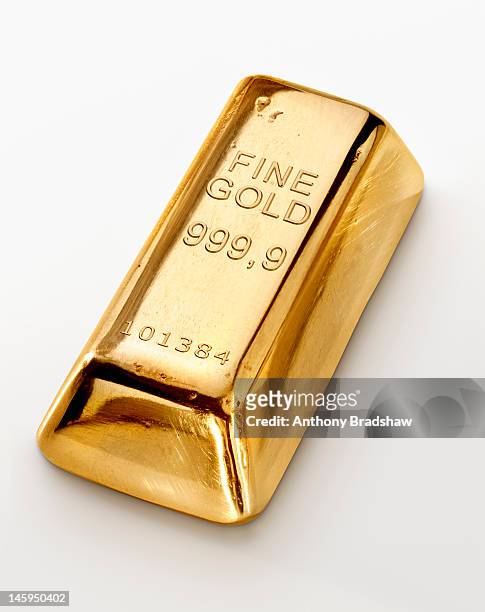 single gold ingot - gold bullion stock pictures, royalty-free photos & images