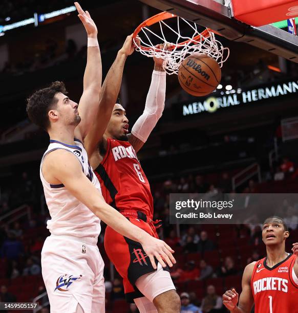 Kenyon Martin Jr. #6 of the Houston Rockets dunks over Deni Avdija of the Washington Wizards during the fourth quarter at Toyota Center on January...
