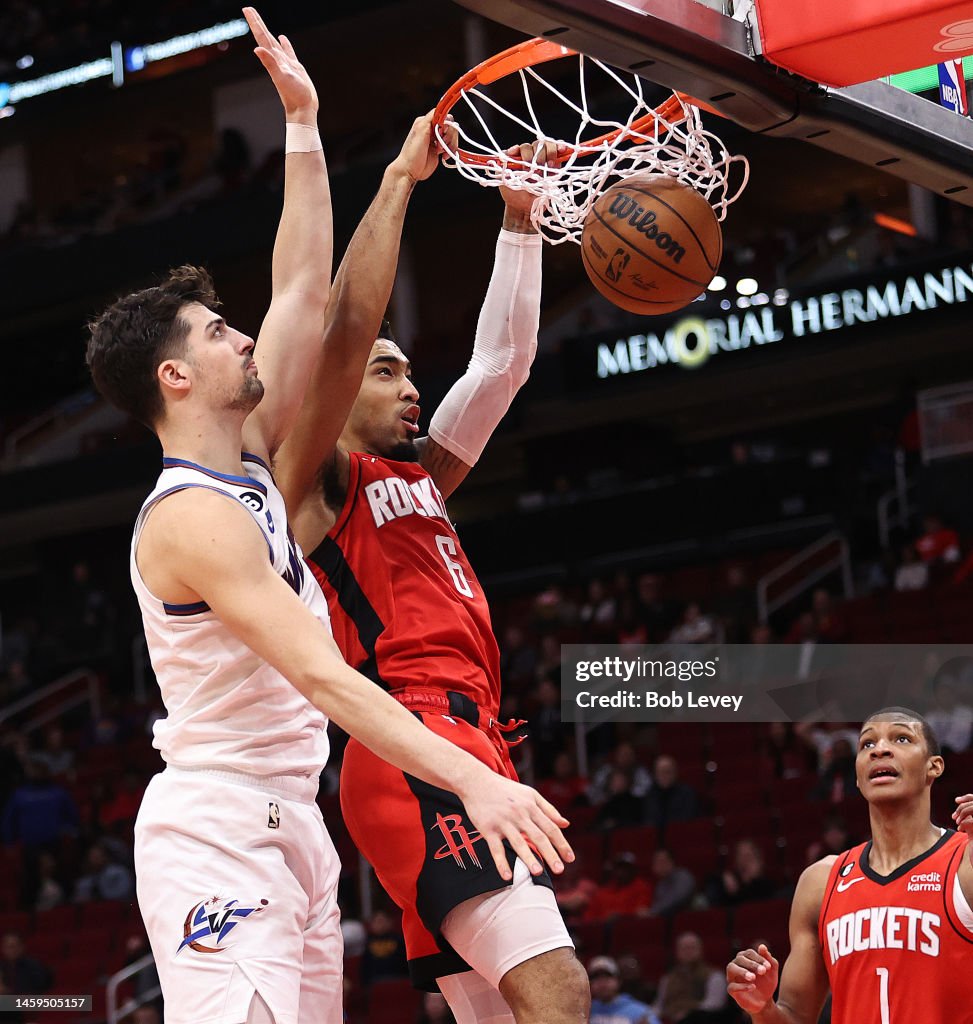 Wizards Rockets Kenyon Martin Jr. #6 of the Houston Rockets dunks over Deni Avdija of ...