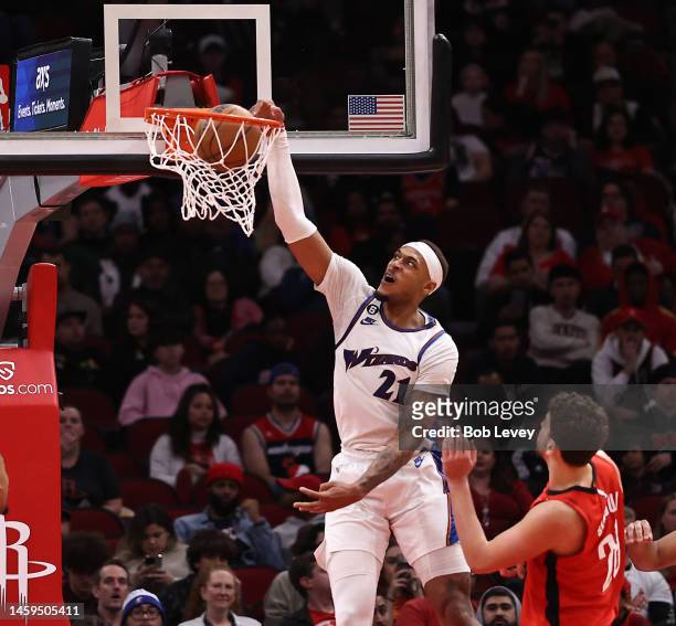 Daniel Gafford of the Washington Wizards dunks over Alperen Sengun of the Houston Rockets during the fourth quarter at Toyota Center on January 25,...