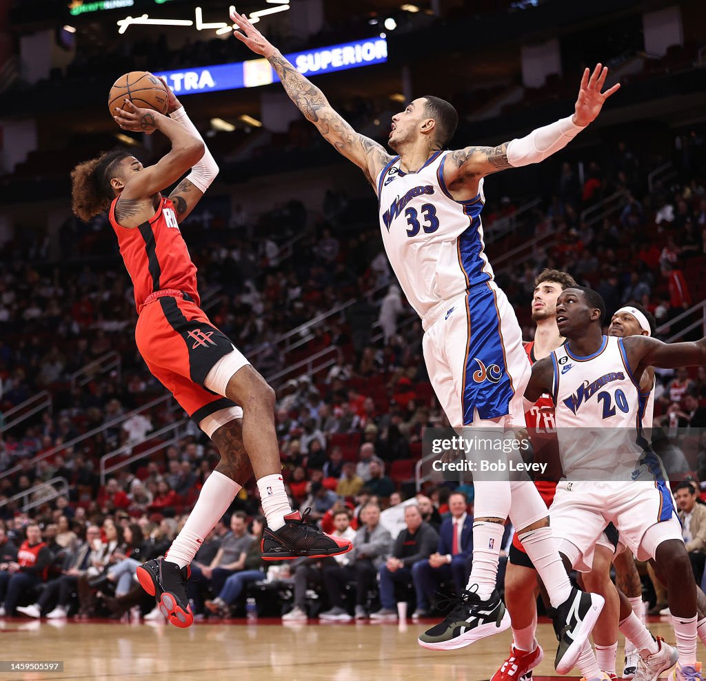 Wizards Rockets Jalen Green of the Houston Rockets shoots over Kyle Kuzma of the ...