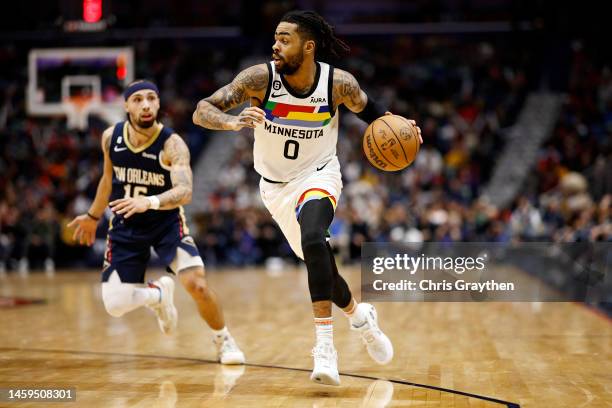 Angelo Russell of the Minnesota Timberwolves drives the ball over Jose Alvarado of the New Orleans Pelicans at the Smoothie King Center on January...