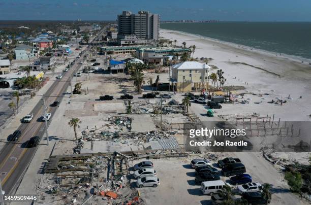 In this aerial view, cleared lots are all that remain of some homes and businesses that were destroyed by Hurricane Ian on January 25, 2023 in Fort...
