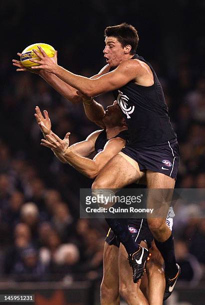 Matthew Kreuzer of the Blues marks during the round 11 AFL match between the Carlton Blues and the Geelong Cats at Etihad Stadium on June 8, 2012 in...