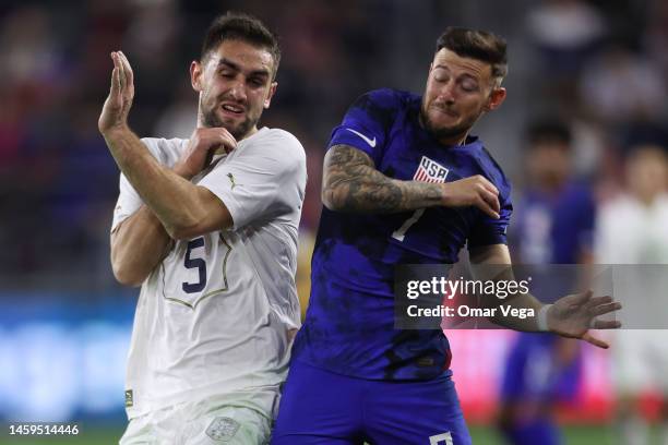 Paul Arriola of the United States and Marko Mijailovi of Serbia fight for position during the international friendly match between the United States...