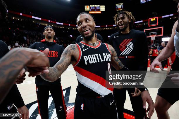 Damian Lillard of the Portland Trail Blazers celebrates with teammates after a 134-124 victory over the Utah Jazz at Moda Center on January 25, 2023...