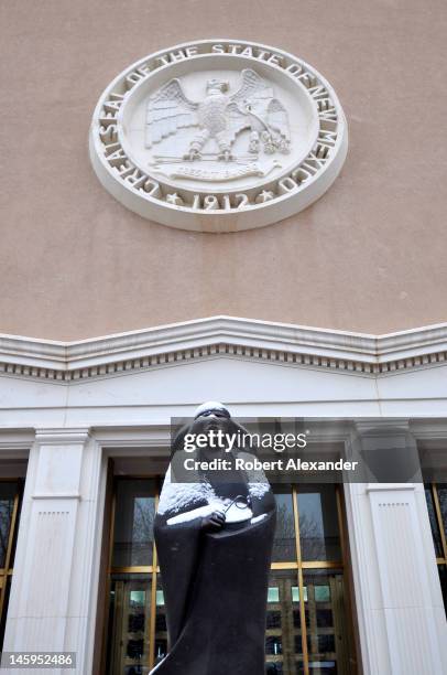 An entrance to the New Mexico State Capitol in Santa Fe, known as the Roundhouse, features a bronze sculpture by Allan Houser. The structure is the...