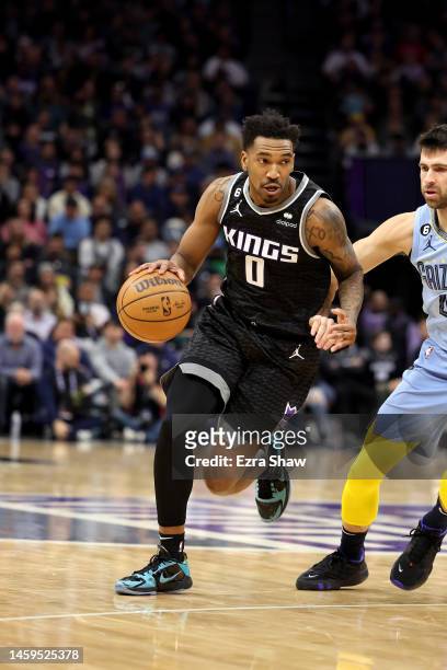 Malik Monk of the Sacramento Kings dribbles the ball against the Memphis Grizzlies at Golden 1 Center on January 23, 2023 in Sacramento, California....